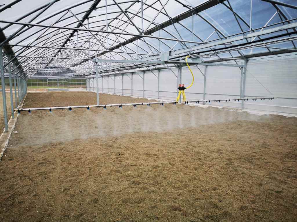 Irigation system working inside of industrial greenhouse