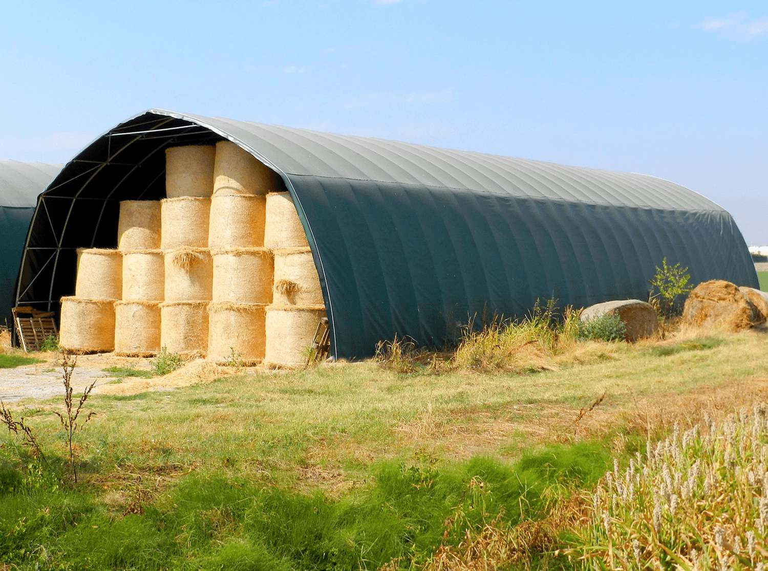 Plastic hall tunnel interior with hay bales