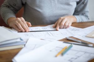 Engineer studying project drawings
